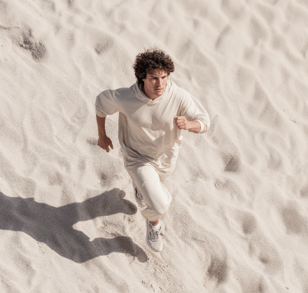 Man Running Sand Dunes Fitness - Longevity Webflow Template | Brix Templates