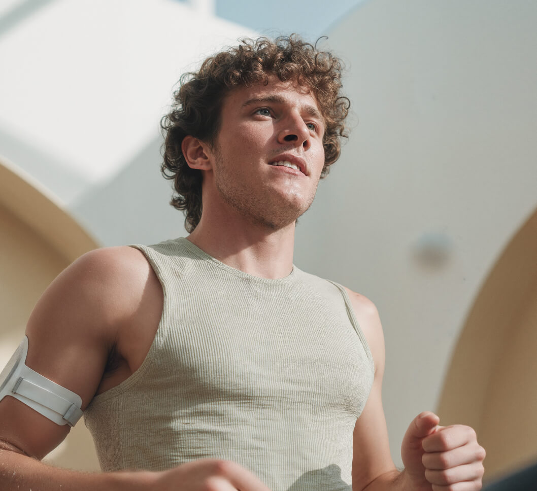 Active Man Running FItness Armband - Longevity Webflow Template | Brix Templates