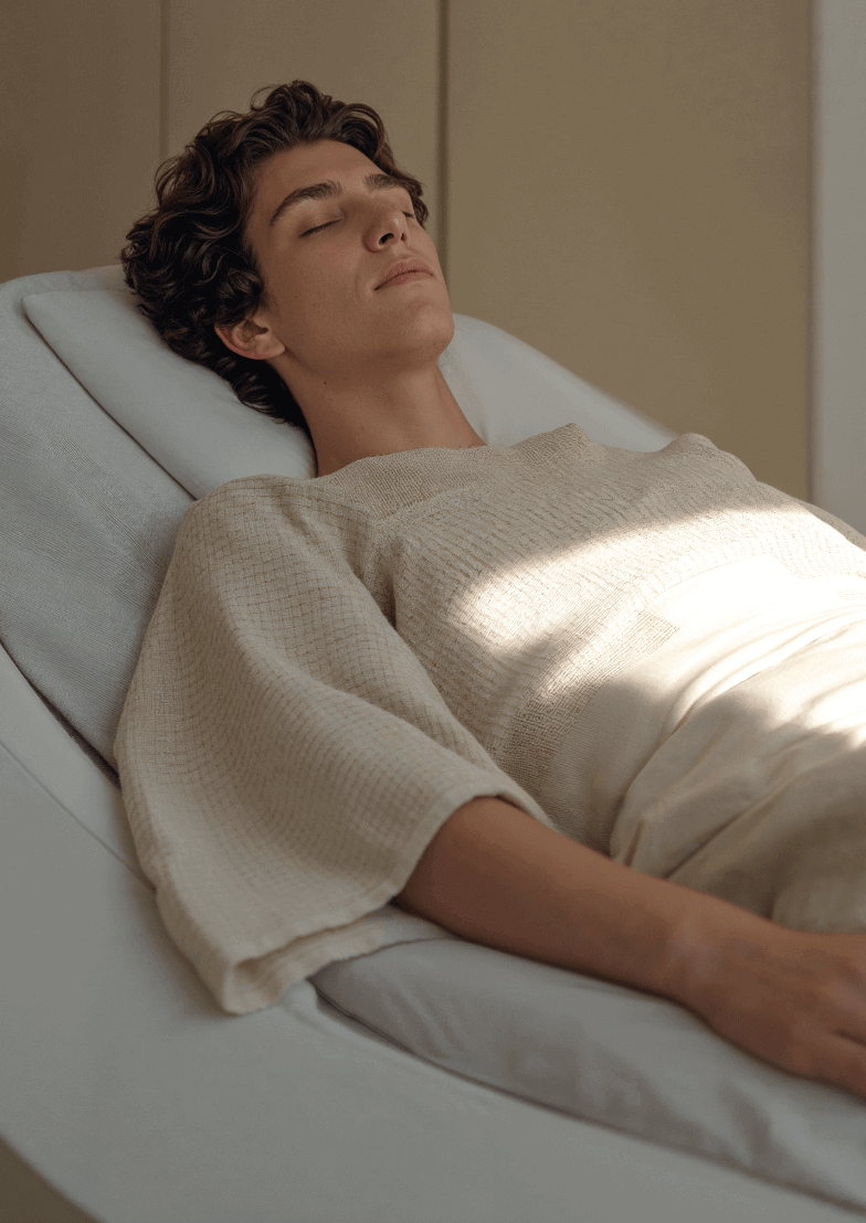 Man Resting Therapy Bed Clinic - Longevity Webflow Template | Brix Templates